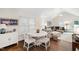 Bright open-concept area with a round table, hardwood floors, and a seamless flow into the living space at 2415 Van Dyke Ave, Raleigh, NC 27607