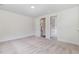 Carpeted bedroom featuring two doorways and natural light at 2434 Heron Watch Pl, Fuquay Varina, NC 27526