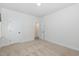 This bedroom features carpet floors, a walk in closet and neutral paint at 2434 Heron Watch Pl, Fuquay Varina, NC 27526