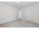 Neutral bedroom with carpet flooring, two entry doors, and natural light at 2434 Heron Watch Pl, Fuquay Varina, NC 27526