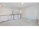 Second floor loft area with light, neutral walls and carpet, a railing, and recessed lighting at 2434 Heron Watch Pl, Fuquay Varina, NC 27526