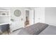 Charming bedroom with a dresser, round mirror, and natural light, creating a cozy and inviting space at 261 Emory Bluffs Dr, Holly Springs, NC 27540