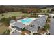 Enjoy the community pool on a hot day with water slide and plenty of lounge chairs at 261 Emory Bluffs Dr, Holly Springs, NC 27540