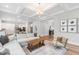 Spacious open-concept living room connected to the kitchen and entry at 261 Emory Bluffs Dr, Holly Springs, NC 27540