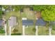 Aerial view of the property, showcasing the house, yard, metal roof, and surrounding neighborhood at 2712 Cameron Dr, Sanford, NC 27332
