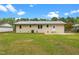 Home's backyard shows a concrete patio and exterior at 2712 Cameron Dr, Sanford, NC 27332