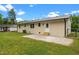 Backyard with a metal roof, painted brick, and a small patio at 2712 Cameron Dr, Sanford, NC 27332