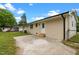 Home's backyard shows a concrete patio and exterior door at 2712 Cameron Dr, Sanford, NC 27332