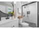 Updated bathroom featuring a sleek vanity, modern fixtures, and a stylish glass-enclosed shower at 2712 Cameron Dr, Sanford, NC 27332