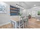 Dining room with stylish lighting fixture, hardwood floors, and comfortable seating at 2712 Cameron Dr, Sanford, NC 27332