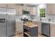 Modern kitchen featuring stainless steel appliances and an island at 2712 Cameron Dr, Sanford, NC 27332