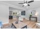 Bright living room featuring hardwood floors, ceiling fan, built-in shelving, and neutral paint at 2712 Cameron Dr, Sanford, NC 27332