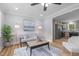Cozy living room with hardwood floors, neutral paint, and an open layout to the kitchen at 2712 Cameron Dr, Sanford, NC 27332