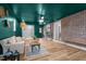 Inviting living room features a brick wall, wood floors, and stylish decor at 2712 Cameron Dr, Sanford, NC 27332