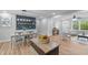 Open-concept with dining area, hardwood flooring, and ample natural light at 2712 Cameron Dr, Sanford, NC 27332