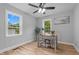 Bright office featuring hardwood floors and natural light from two windows at 2712 Cameron Dr, Sanford, NC 27332