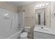 Full bathroom features tub/shower combo, tile floor, and single sink vanity at 286 Trillium Way, Clayton, NC 27527