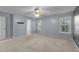 Large bedroom features neutral paint, ceiling fan, carpeting, and lots of natural light at 286 Trillium Way, Clayton, NC 27527