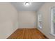 This bedroom features hardwood floors, neutral paint, one window and a ceiling light at 286 Trillium Way, Clayton, NC 27527