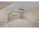 Spacious bedroom featuring neutral carpet, natural light from the window, and a ceiling fan at 286 Trillium Way, Clayton, NC 27527