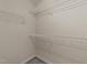 Walk-in closet boasts wire shelves for ample storage at 286 Trillium Way, Clayton, NC 27527