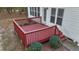 Wooden deck area with stained railings and steps leading to the yard at 286 Trillium Way, Clayton, NC 27527