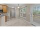 Bright dining area with tile floor, large windows, and access to the outdoors at 286 Trillium Way, Clayton, NC 27527