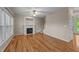 Spacious living room with hardwood floors, fireplace, and lots of natural light at 286 Trillium Way, Clayton, NC 27527