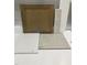 A design sample featuring a cabinet, floor tile, wall tile, and a quartz countertop, showcasing modern interior design at 311 Chesapeake Commons St # 101, Garner, NC 27529