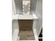 A design option featuring herringbone backsplash tiles, a quartz countertop, stylish cabinet and luxury vinyl flooring at 311 Chesapeake Commons St # 101, Garner, NC 27529