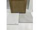 A design sample featuring a cabinet, floor tile, wall tile, and a quartz countertop, showcasing modern interior design at 311 Chesapeake Commons St # 101, Garner, NC 27529