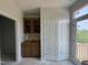 An open living area with storage, featuring natural light and accessibility to outdoor spaces at 311 Chesapeake Commons St # 101, Garner, NC 27529