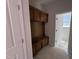 Functional mudroom featuring a built-in bench with storage and convenient hooks for organizing outerwear at 311 Chesapeake Commons St # 101, Garner, NC 27529