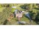 Beautiful aerial view of a brick home, in-ground pool, gazebo and expansive yard on a sunny day at 3542 Bason Rd, Mebane, NC 27302
