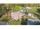 Expansive property featuring a pool, barn, and beautifully landscaped grounds surrounding the brick home at 3542 Bason Rd, Mebane, NC 27302