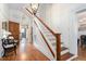 Elegant foyer with hardwood floors, a staircase, and decorative details at 3542 Bason Rd, Mebane, NC 27302