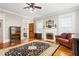 Inviting living room featuring hardwood floors, a fireplace, and comfortable seating at 3542 Bason Rd, Mebane, NC 27302