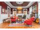 Cozy living room with a fireplace, area rug, and vintage furniture at 3542 Bason Rd, Mebane, NC 27302