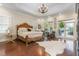 Bright and airy main bedroom with hardwood floors and access to outdoor patio at 3542 Bason Rd, Mebane, NC 27302