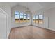 An elegant living room with high ceilings, beautiful windows, and paneled walls at 3941 Wendell Blvd, Wendell, NC 27591