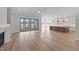 Spacious open-concept living area with lots of light and wood floors that flow into the kitchen at 3941 Wendell Blvd, Wendell, NC 27591