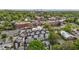 Scenic aerial view of townhomes featuring rooftop patios, surrounded by trees and the cityscape at 400 W Rosemary St # 104, Chapel Hill, NC 27516