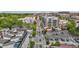 An aerial view captures city buildings along a tree-lined street with pedestrian crosswalks and parallel parking at 400 W Rosemary St # 104, Chapel Hill, NC 27516