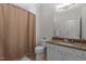 Bathroom featuring neutral colors, shower with curtain, toilet, and granite countertop at 400 W Rosemary St # 104, Chapel Hill, NC 27516