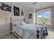 Bright bedroom with a large window, comfortable bed, and tasteful decor creating a relaxing space at 400 W Rosemary St # 104, Chapel Hill, NC 27516