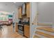 The kitchen showcases stainless appliances, granite countertops, and leads to a staircase to the second level at 400 W Rosemary St # 104, Chapel Hill, NC 27516