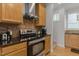 Modern kitchen featuring stainless steel appliances and granite countertops at 400 W Rosemary St # 104, Chapel Hill, NC 27516