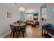 Open concept space with dining area and living room featuring hardwood floors at 400 W Rosemary St # 104, Chapel Hill, NC 27516