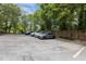 Well-maintained parking lot with various parked cars, offering convenient resident parking at 400 W Rosemary St # 104, Chapel Hill, NC 27516