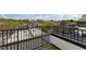 View of rooftops with black railings and artificial turf, offering city views at 400 W Rosemary St # 104, Chapel Hill, NC 27516